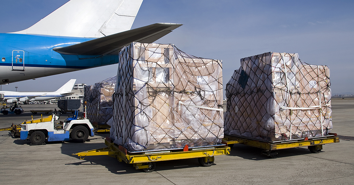 Ground crew loading a cargo container onto an aircraft